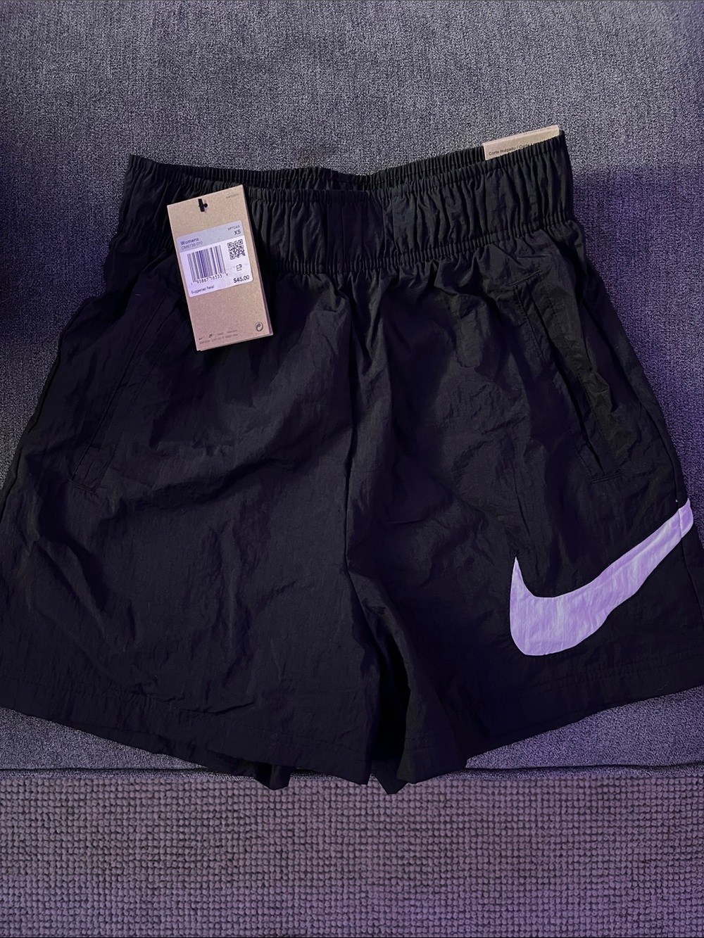 Nike Women’s Black Athletic Shorts with White Swoosh Accent